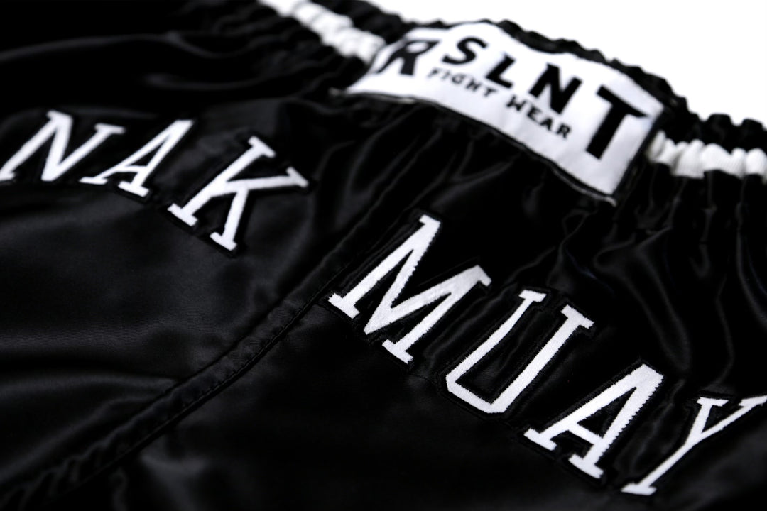 “Nak Muay” Muay Thai Shorts (Black / White)